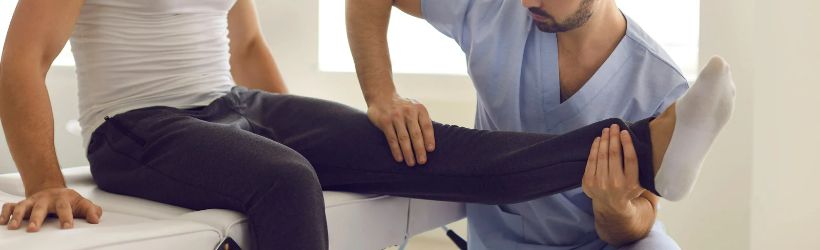 A man getting checked over by a nurse after his compression therapy session