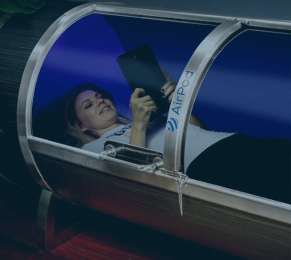 A woman receiving hyperbaric oxygen therapy to help reduce her anxiety and improve her mental health.