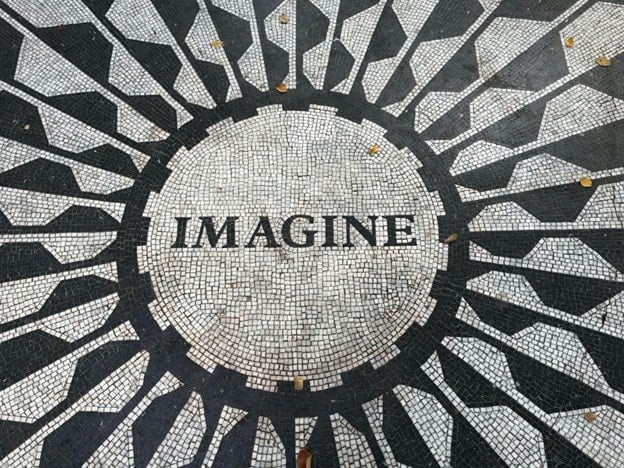 the word imagine on mosaic tiles