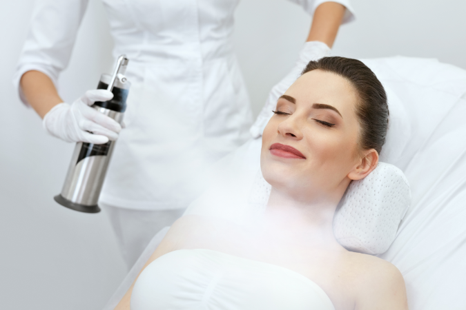 A woman recieving cryotherapy treatment to show what is a cryo facial.